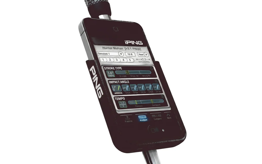 The iPING cradle holding an iPhone on a putter shaft, showing the app&rsquo;s stroke readouts